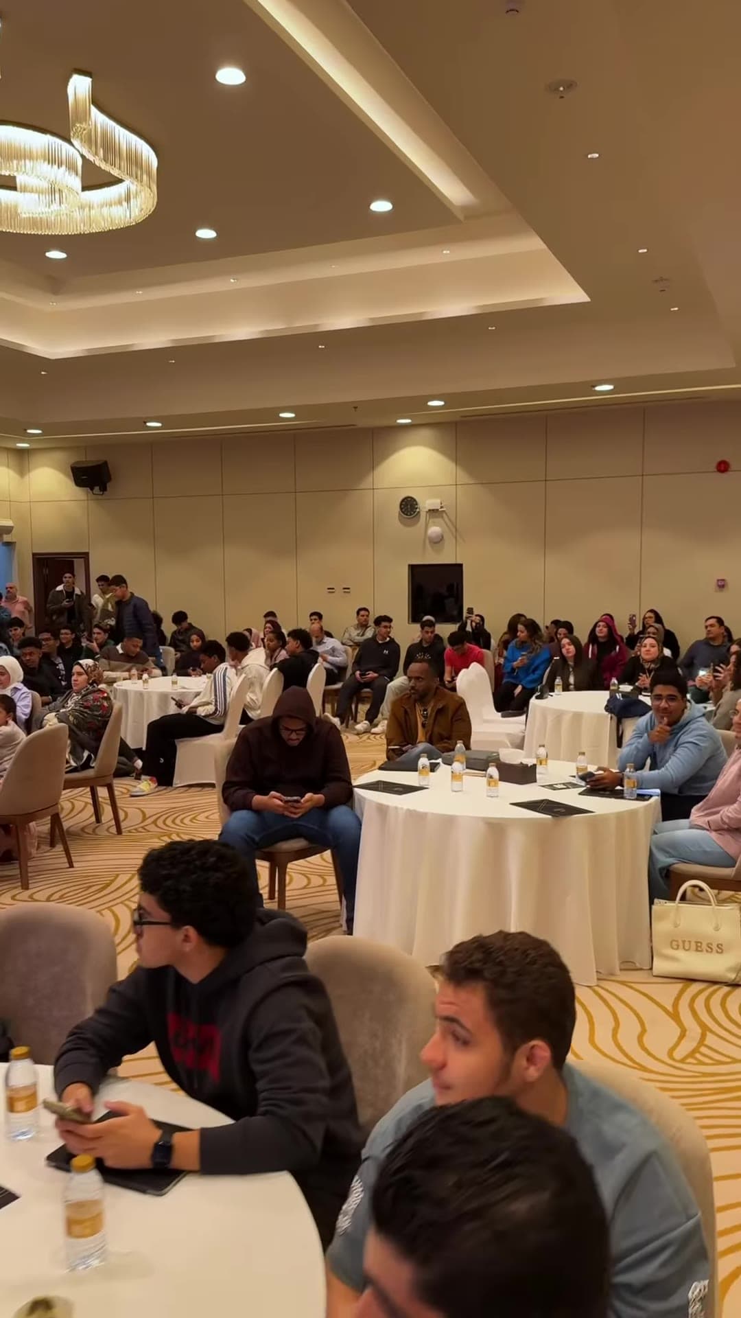 Students seated at tables during the session