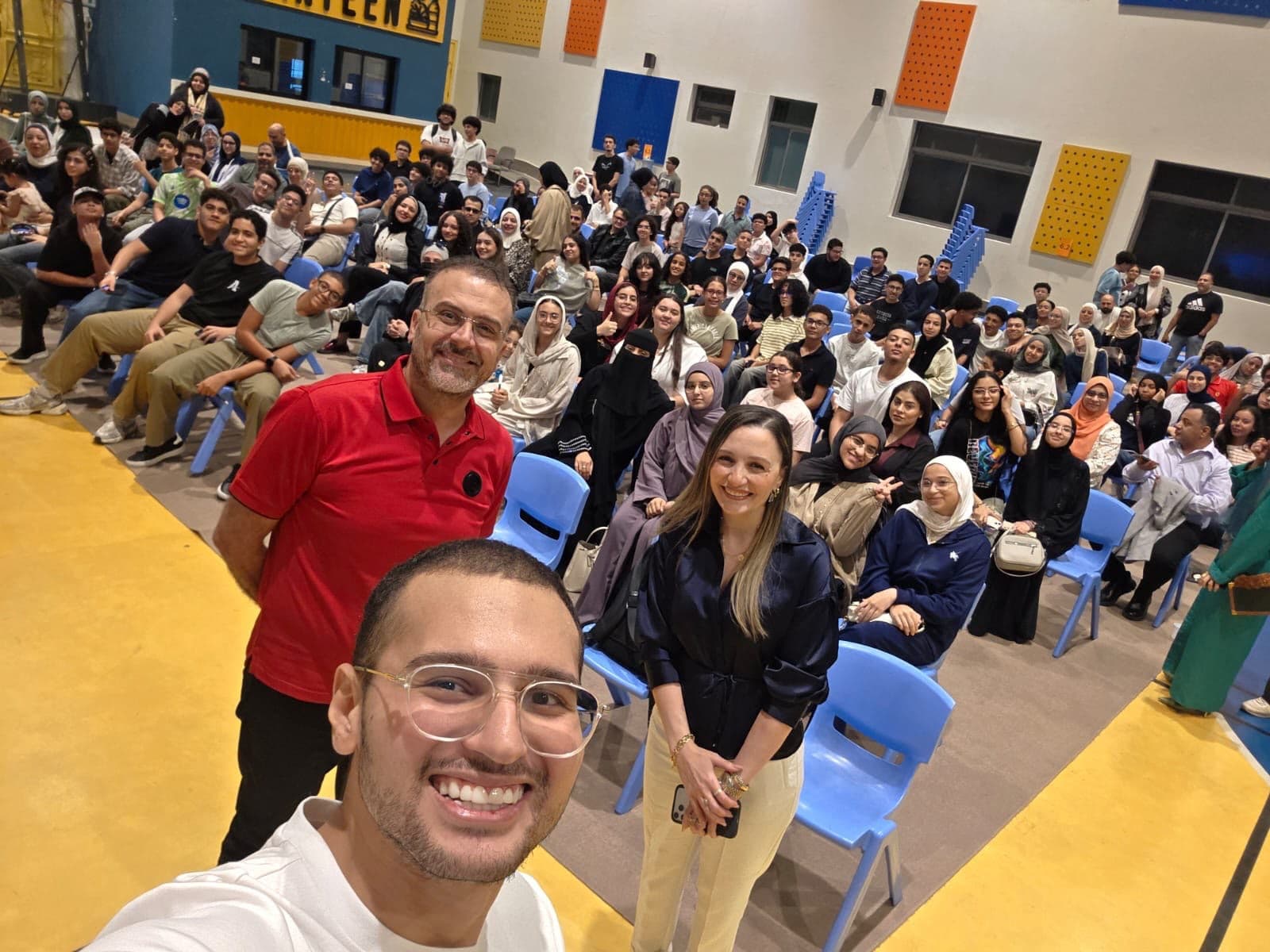 Saif Atef with students and educators at a community gathering