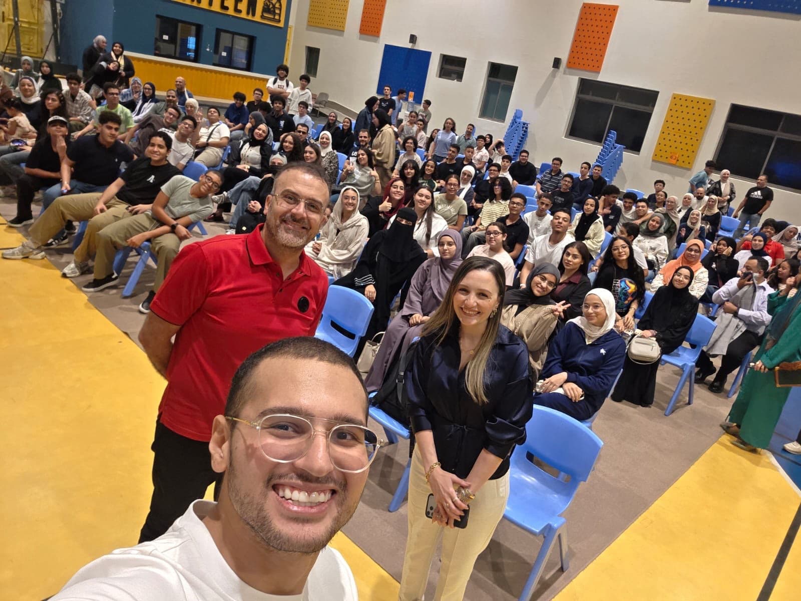 Saif Atef and students at an education community gathering