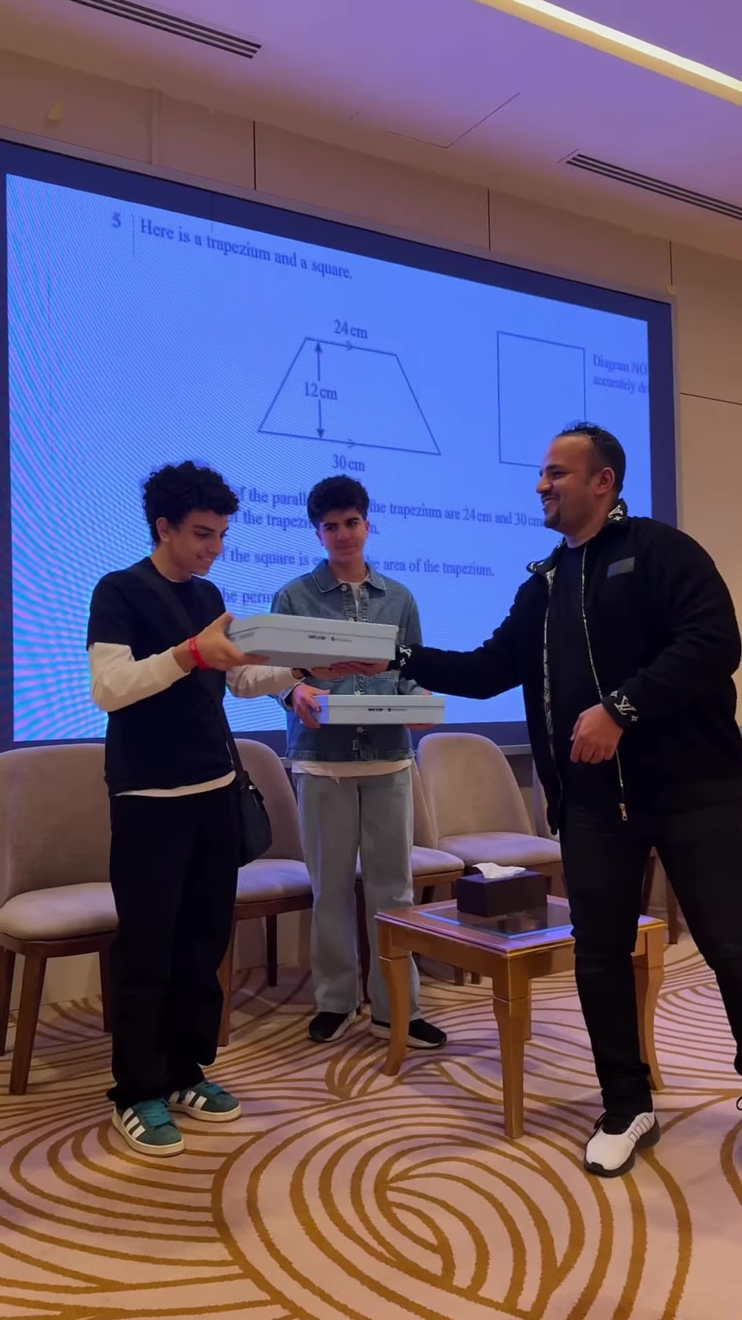 Students receiving prizes on stage