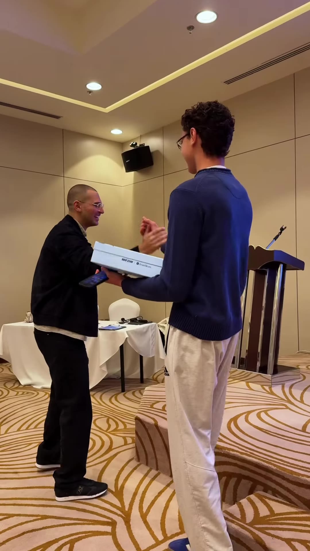 A student receiving a prize on stage